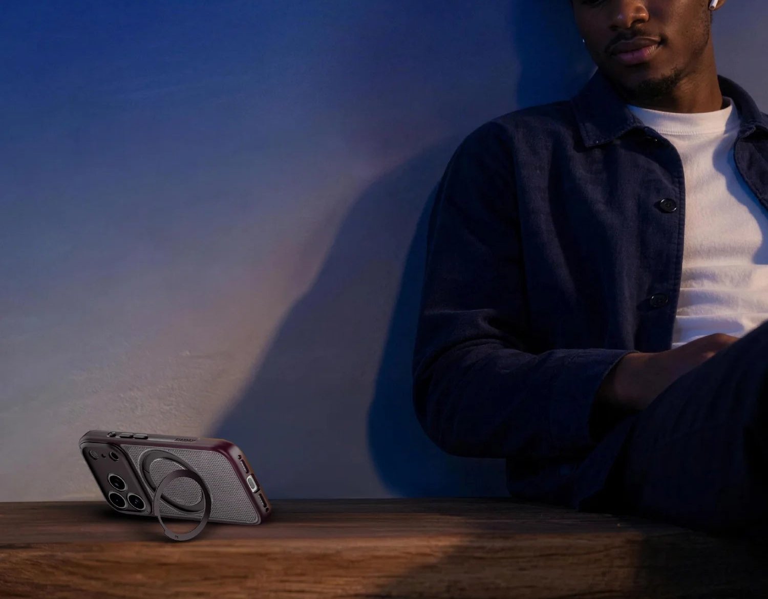 SŌMA Roller holding an iPhone upright on a desk